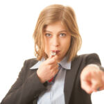 Ruel 21Fโ18 – Summary disposition Concept for corporate whistle blowing. A business woman blowing a sports whistle.