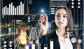 Attractive young businesswoman using abstract digital business interface on blurry city background. Finance and innovation concept. Double exposure