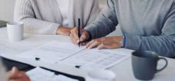 Cropped shot of a senior couple meeting with a consultant to discuss paperwork at home