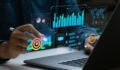 Businessman works on laptop Showing 2024 business trends dashboard with charts, metrics, AI, E-commerce, KPI. analytical businessperson planning business growth 2024. New Year Future business tech.