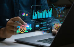 Businessman works on laptop Showing 2024 business trends dashboard with charts, metrics, AI, E-commerce, KPI. analytical businessperson planning business growth 2024. New Year Future business tech.