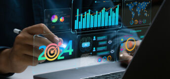 Businessman works on laptop Showing 2024 business trends dashboard with charts, metrics, AI, E-commerce, KPI. analytical businessperson planning business growth 2024. New Year Future business tech.