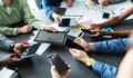 Hands with mobiles and digital tablets% sharing energy, information. Business technology concept.