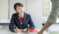 Asian female high school student and teacher in classroom. Cram school. Preparatory school. Home tutor.