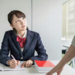 Asian female high school student and teacher in classroom. Cram school. Preparatory school. Home tutor.