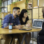 Consultant giving some advice for customer at business meeting