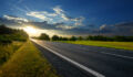 Empty asphalt road in the countryside at sunset