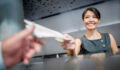 Woman working at the airport in the check-in counter