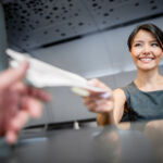 Woman working at the airport in the check-in counter