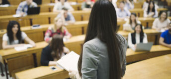 Students sitting in amphitheater and studying