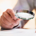Businessman Reading Contract Details Before Signing