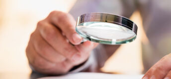 Businessman Reading Contract Details Before Signing