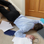 Business man falling down the stairs in the office concept for accident and insurance injury claim at work