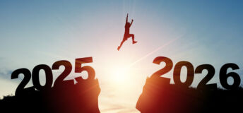 Welcome merry Christmas and happy new year in 2026,Silhouette Man jumping from 2025 cliff to 2026 cliff with cloud sky and sunlight.