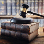 Judge gavel and law books in court, law and justice background concept