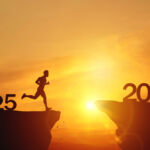 Private funds: Despite volatility, 2025 was kind to PFs New Year 2026, Inspiration and progress towards new success. Silhouettes of human jumping over cliff towards finish line with text new year 2026 on sunset beautiful