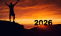 Man silhouette on the mountain top watching the sunrise of the new year 2026 , Highlighting New Year Dreams and New Goals