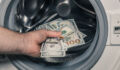 American dollars being put into the washing machine, Concept, Money laundering, Illegal business proceeds, Dark business, Black market, Bundle of 100 dollar bills
