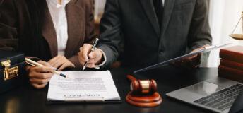 business people and lawyers discussing contract papers sitting at the table. Concepts of law, advice, legal services.