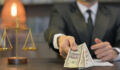 Close up of Male Lawyer Offering Money