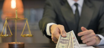 Close up of Male Lawyer Offering Money
