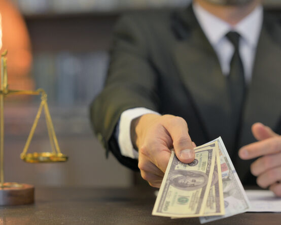 Close up of Male Lawyer Offering Money