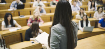 Students sitting in amphitheater and studying