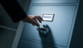 Office worker searching top secret confidential information in the office late at night, data theft and security concept