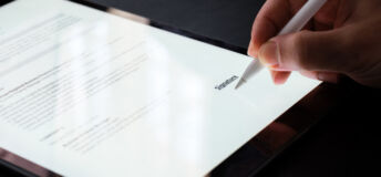Businessman Signing Electronic Contract On Digital Tablet