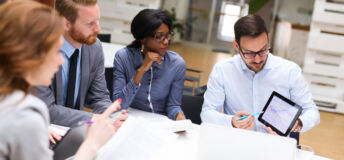 Current SEC exam request letter sent to an adviser Group of business people is working on new business strategy with a financial analyst while analyzing financial chart during meeting in the office.