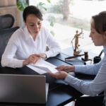 Female legal advisor lawyer helping her client with her legal issues in the office