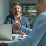 SEC/CFTC crypto final rule and interpretation Shot of two businessmen shaking hands in an office