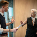 A business woman resists bullying and physically fights back against an abusive man in self-defense.