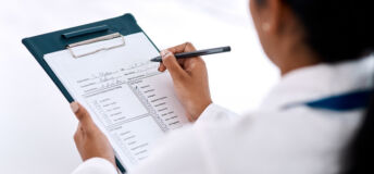 Reg S-P Compliance Checklist for Small Advisers Cropped shot of an unrecognizable female doctor writing on a clipboard while working in her office
