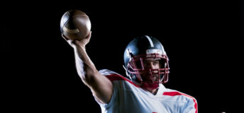 American football player holding a ball royalty-free istock photo