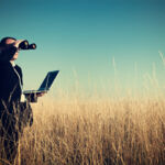 Businessman looking field for investment.