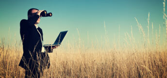Businessman looking field for investment.