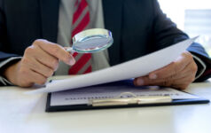 RCW exclusive: SEC examining interval funds Lawyer or judge use magnifier glass look to the paper for inspection examination to the law case
