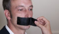 Woman removing tape from person's mouth