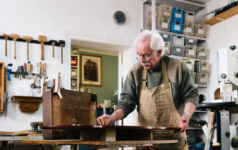 Exam enhancements detailed by FINRA Carpentry workshop where old antique furniture is professionally restored