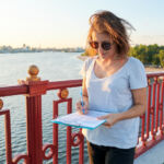 August 3, 2026 RCW Weekly Briefing Business woman working outdoor, female with paper document on clipboard, social worker interviewing people on the street