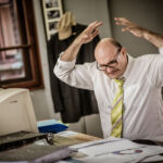 Violations of net-capital rule bring B-D a $10k fine Overworked businessman having problems at work.