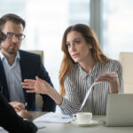 Dissatisfied executive manager having conflict with employee about financial report mistake, disgruntled clients claim complaint disputing about bad contract terms meeting lawyer, legal fraud concept