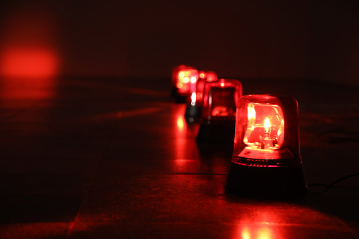 Background with red flashing alarm lights.