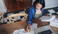 SEC exam risk alert: Observations regarding IA annual compliance reviews Shot of a young woman using a laptop and going through paperwork while working from home
